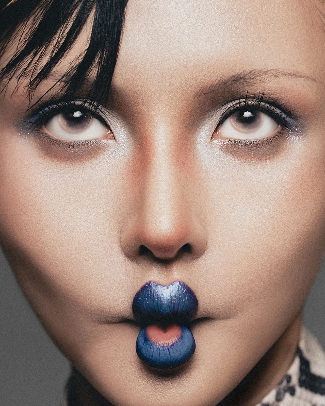 Beauty close-up with glitter blue lips